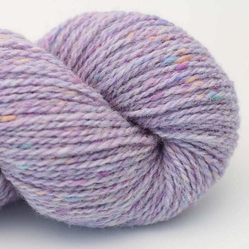 Purple skein of yarn with multicolour speckles Beara Irish wool and UK alpaca tweed dk, worsted or aran weight yarn by Hey Mama Wolf 