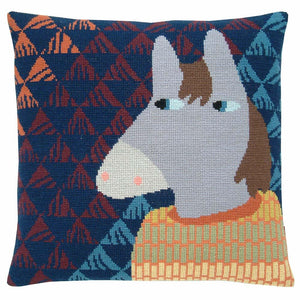 Cross stitch cushion cover with a grey horse wearing a yellow, green and orange jumper on a background of navy, rust, orange and pale blue triangles.