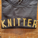 Stitchers Tees Unisex T-Shirt: Black Tee with Gold Lettering