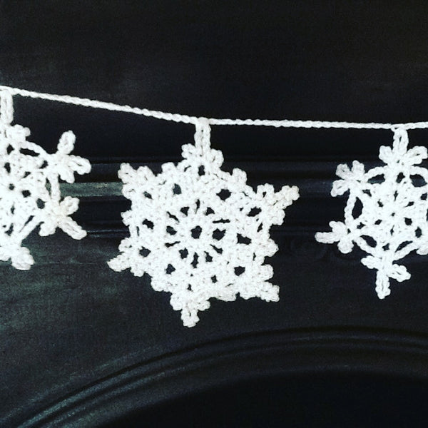 white crocheted snowflake bunting from all about the yarn crocheted snowflake course at Chesterblade hills