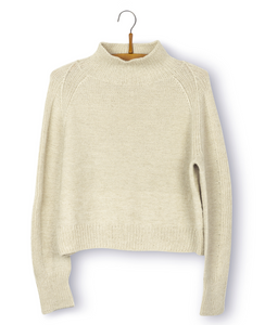 Dune: A cream knitted jumper with a wide raglan increase and turtle neck.